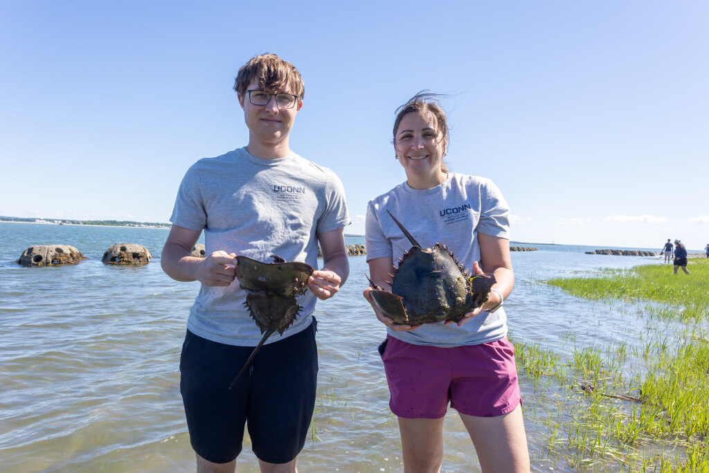 people holding sea creatures
