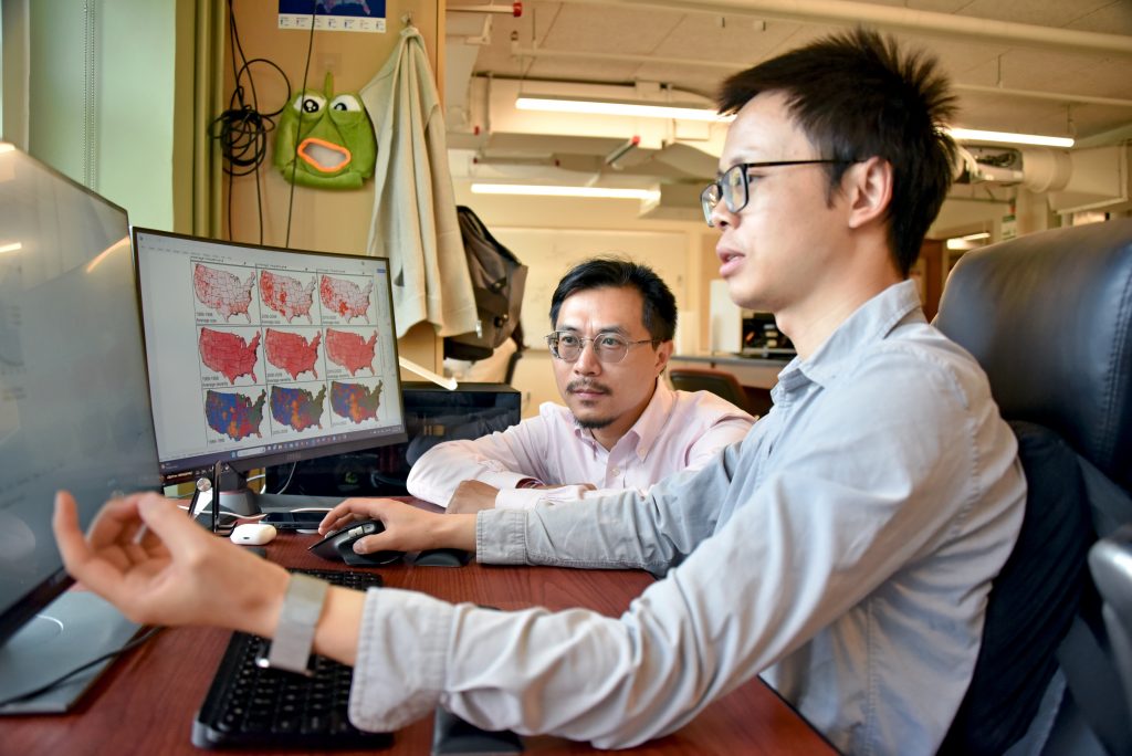 two guys looking at computer
